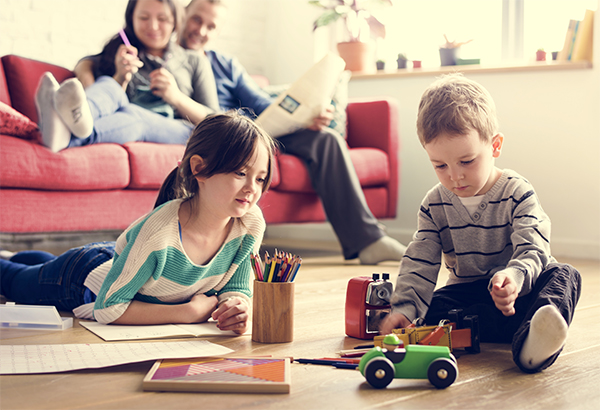 kids playing with toys in front of parents