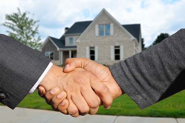 home shaking hands real estate