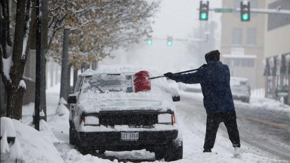 snow-storm-car-parked